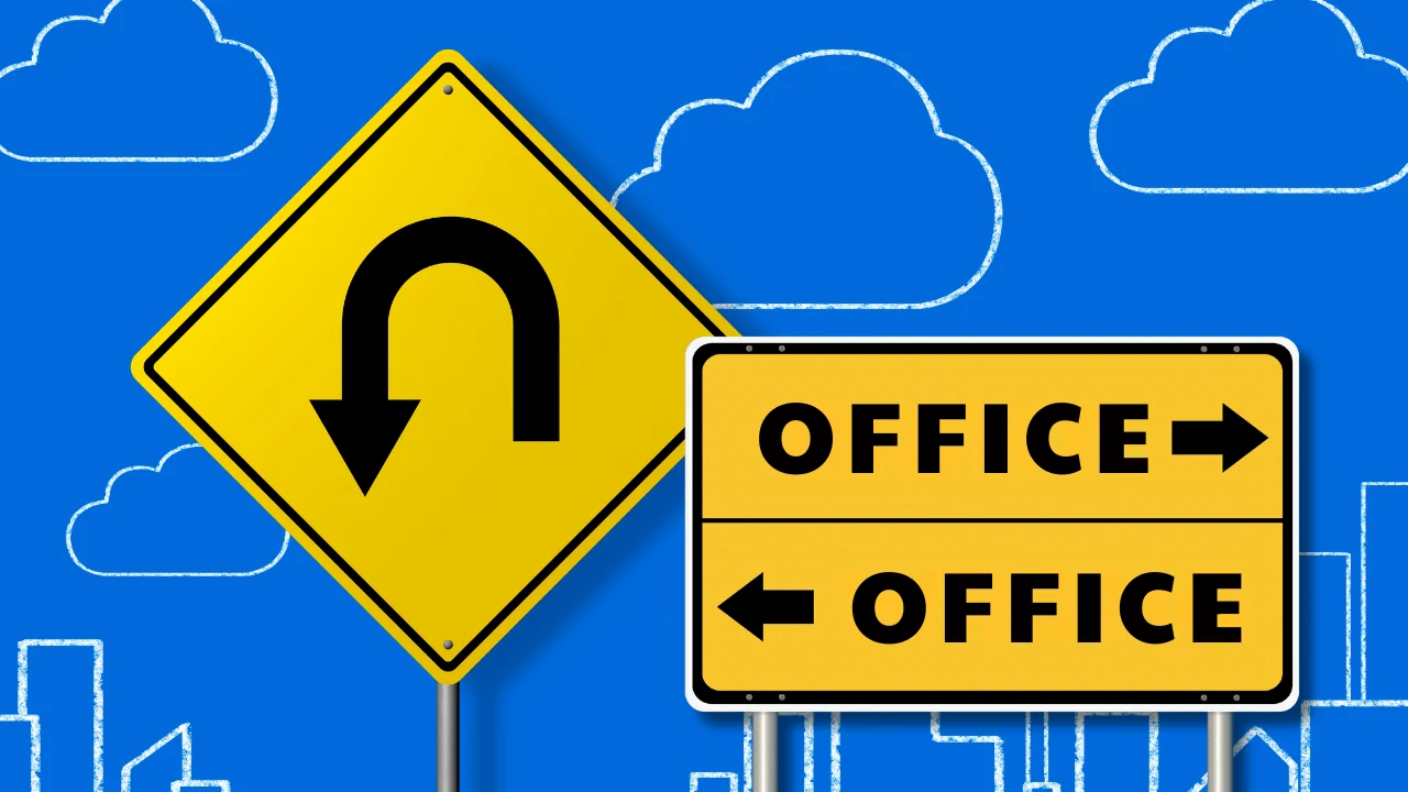 A yellow U-turn road sign beside two signs pointing to the office in opposite directions